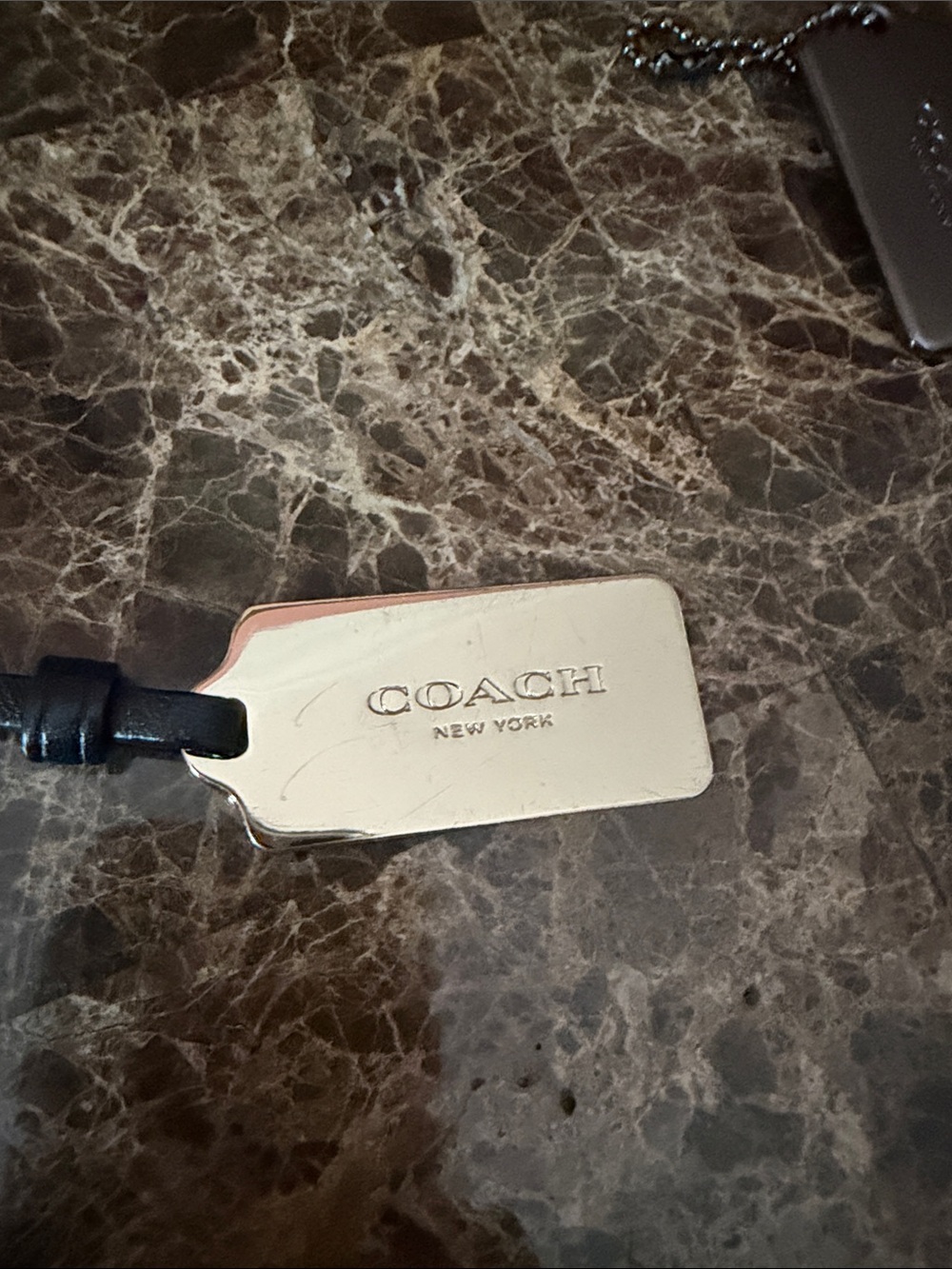 Coach Silver Metal Logo Tag with Black Leather Strap